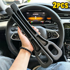 Hand holding two black SeatGuard gap filler strips inside a car